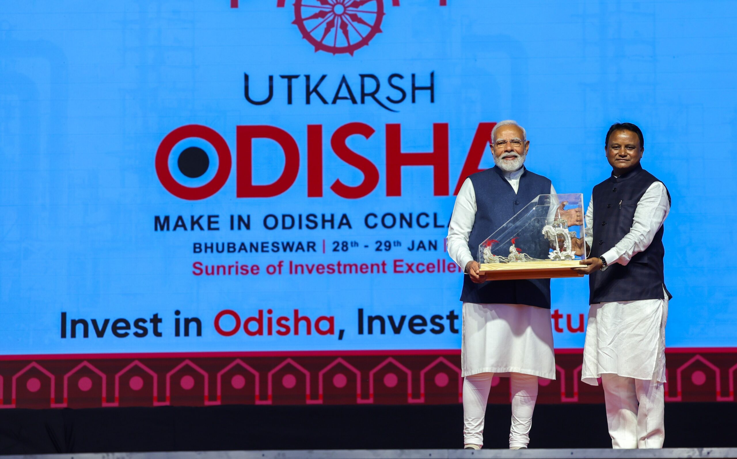 Odisha CM Mohan Majhi (right) felicitates PM Narendra Modi at the Utkarsh Odisha Conclave.